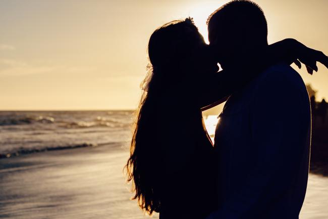 Silhouette of a couple at the beach