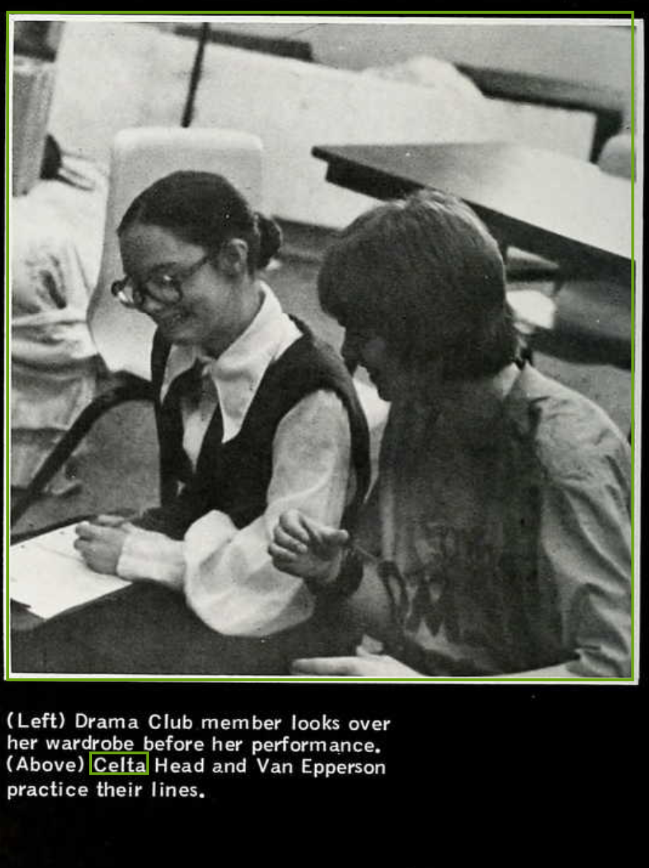 Celta Camille Head in drama club, seated with script, engaged in theatrical activities